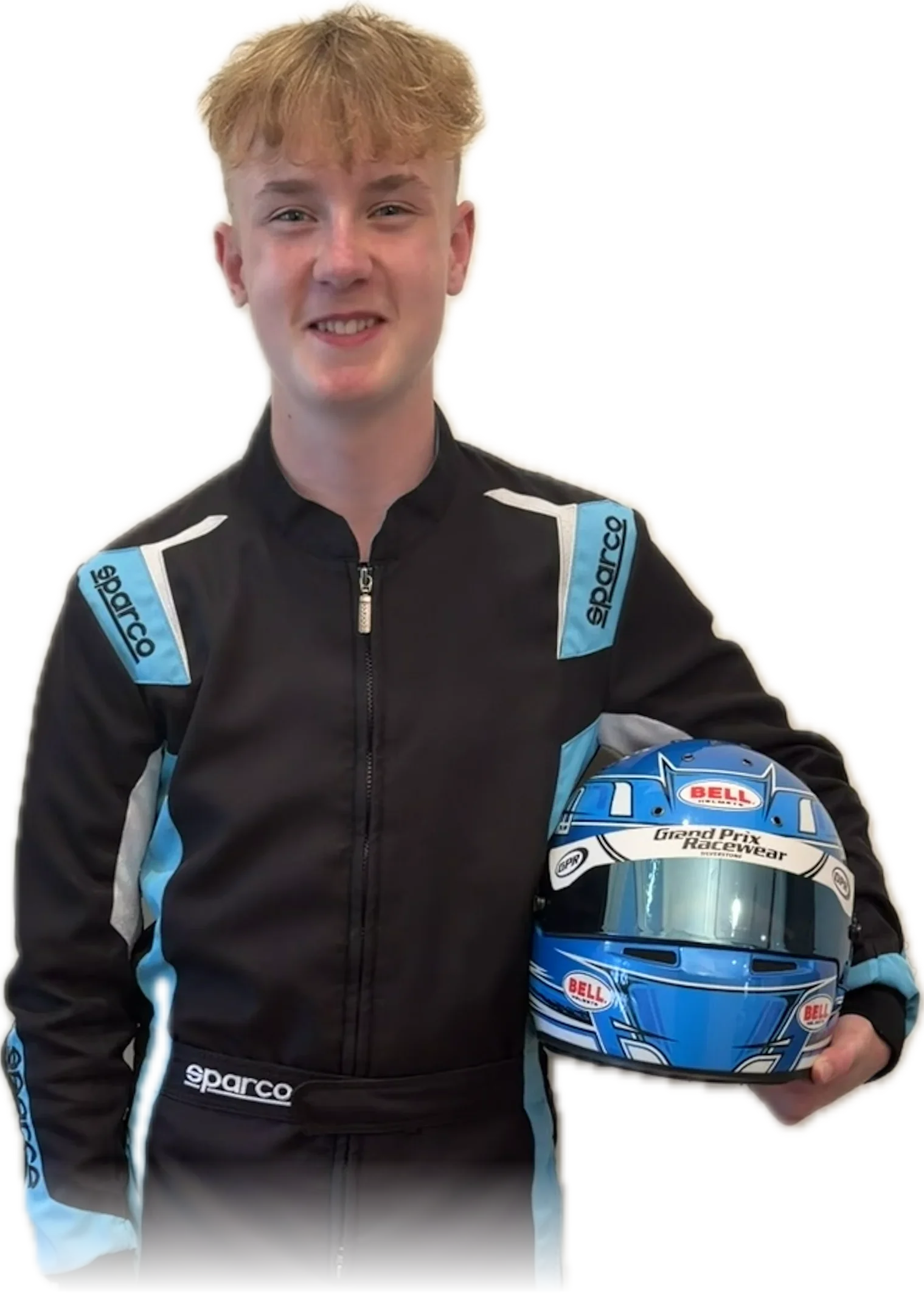 Reuben Tucker in race suit, helmet under his arm